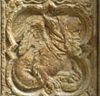 Panel 06:01 - Basilisk with old man's head, wearing pointed hood